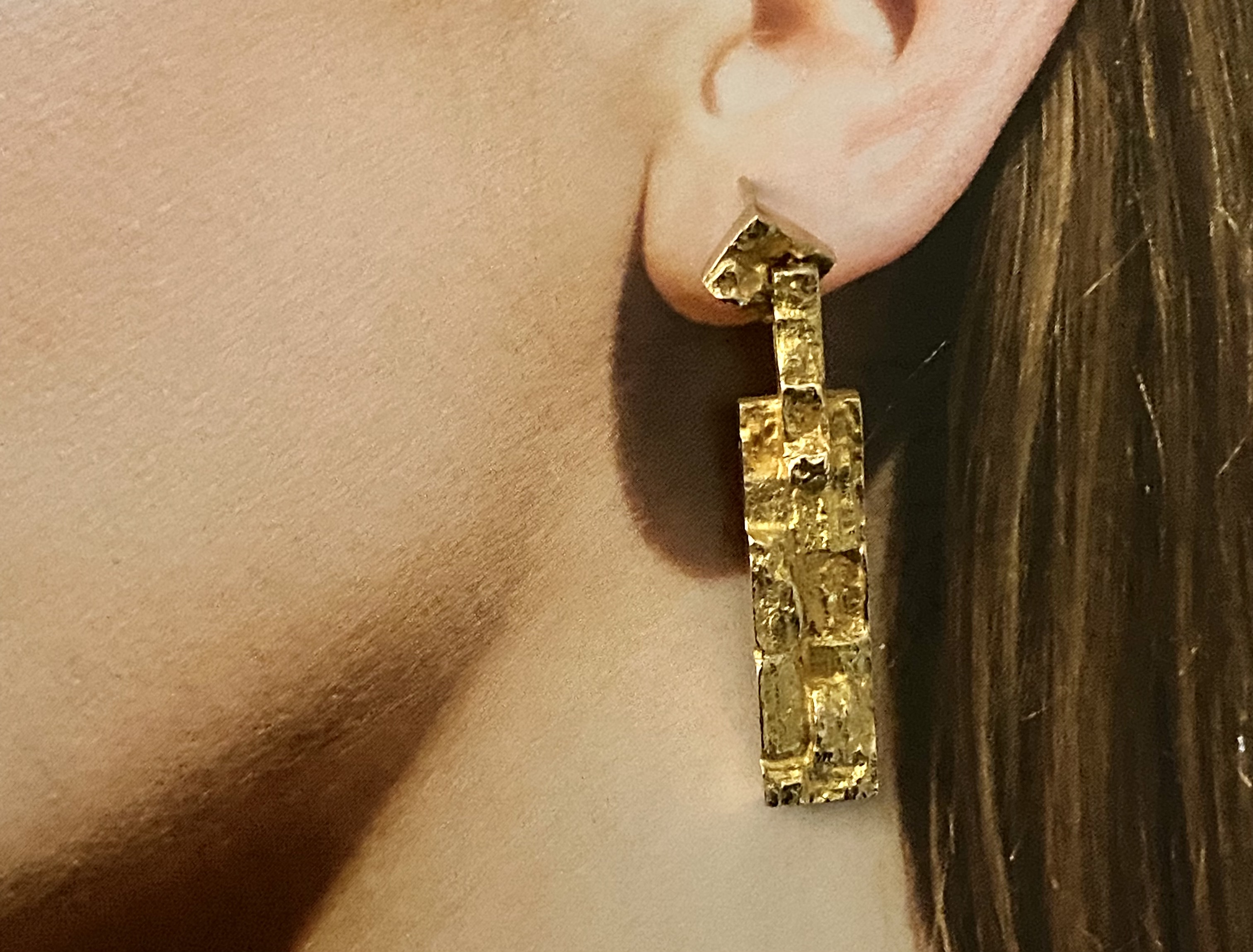Discover the exquisite Gold Bjorn Weckstrom Earrings, featuring a stunning design that combines modern elegance with artistic flair. Perfect for any occasion, these earrings are a must-have addition to your jewelry collection.